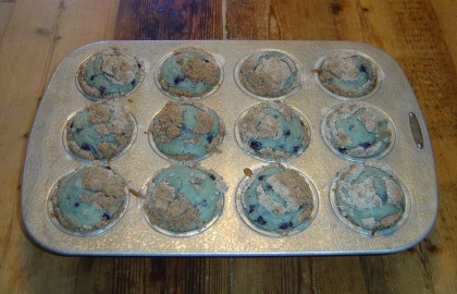 A pan of blueberry-crumb muffins just out of the oven