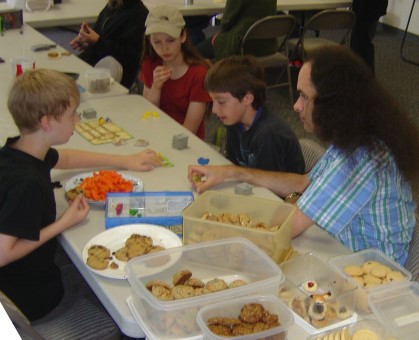 an AFE Games Group picture including lots of cookies and a plate of baby carrots