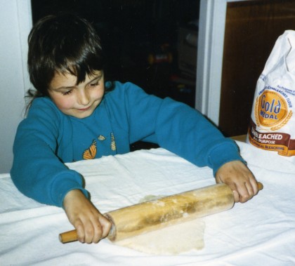 six-year-old Violet rolls out a pie crust