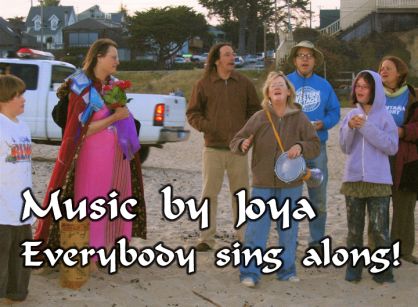 another screen from the 'Meg's Beach Party' music video, crediting Joya for the music and encouraging the audience to sing along